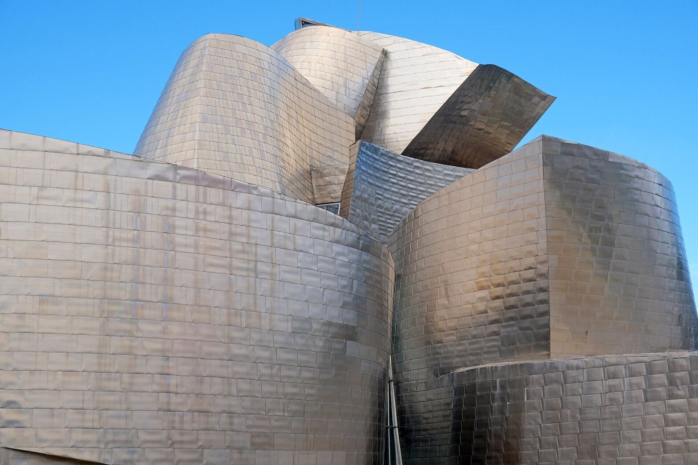 The Guggenheim Museum Bilbao (1997). Its titanium curves were engineered and fabricated from a digital model r